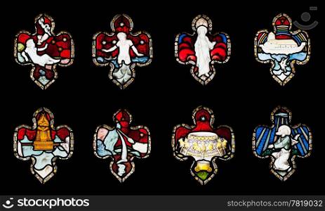 collection of 8 religious stained glass windows in Gloucester Cathedral, England (United Kingdom) (isolated on black background)