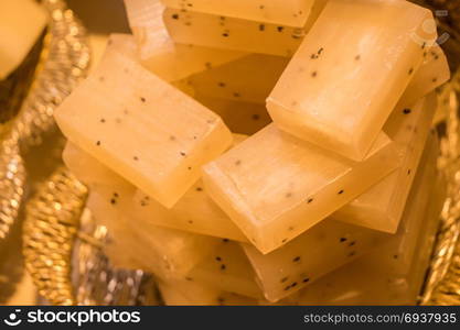 Collection of bars of fragrant hand made organic soap in a basket