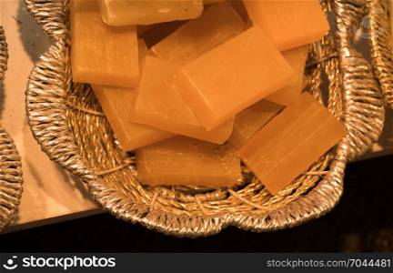 Collection of bars of fragrant hand made organic soap in a basket