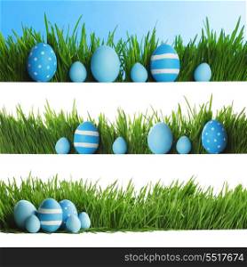 Collection of decorated easter eggs in grass with copy space