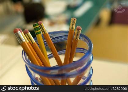 Collection of pencils on teacher&acute;s desk.