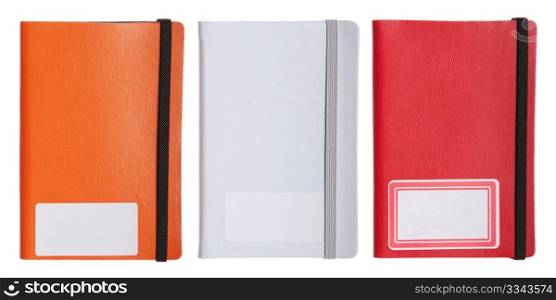 collection of three colorful notebooks, diary or agenda (isolated on white background)