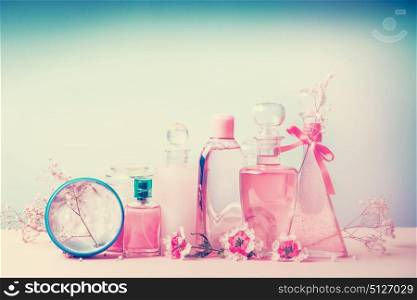 Collection of various beauty bottles and container with cosmetic products: tonic,lotion, perfume,Moisturizer,cream, soups, foams, shampoo. Pastel color. Cosmetic shop and beauty treatment, horizontal