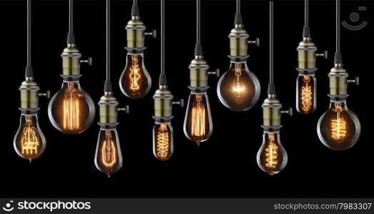 Collection of vintage glowing light bulbs on black