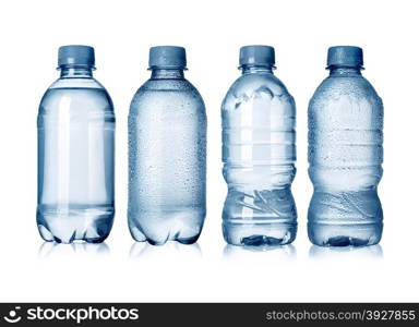 Collection of water bottles with drops isolated on white background