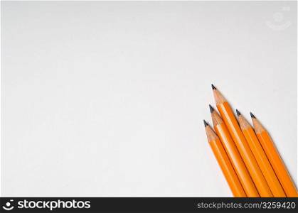 Collection of yellow pencils on a white background.