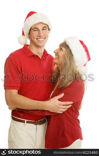 College aged young man and his mom laughing together on Christmas. Isolated on white.