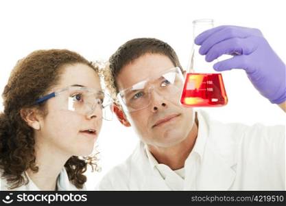 College chemistry student and her professor examining the clarity of a chemical compound. White background