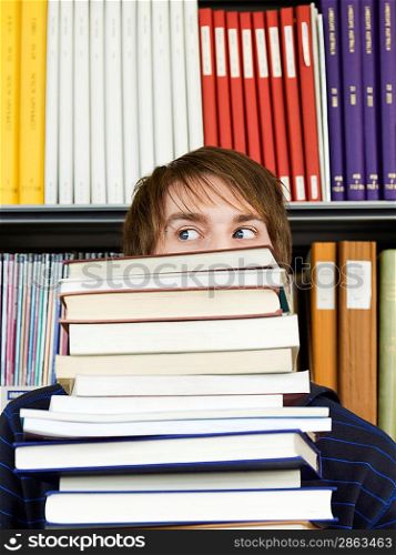 College Student Carrying Stack of Books