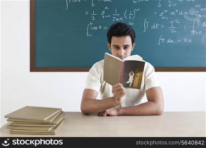 College student reading a book