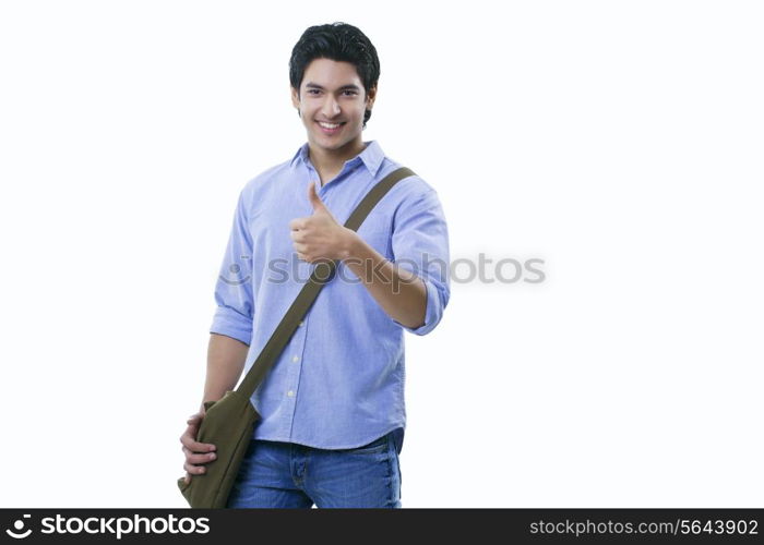 College student showing thumbs up sign over white background