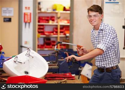 College Students Studying Plumbing Working At Bench