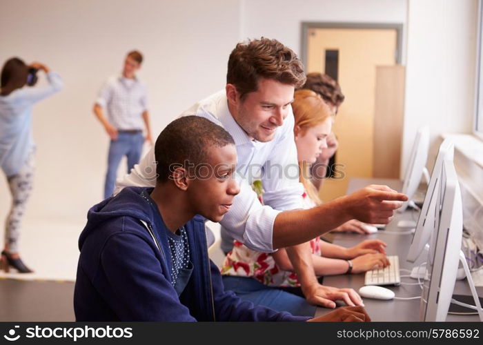 College Students Using Computers On Media Studies Course