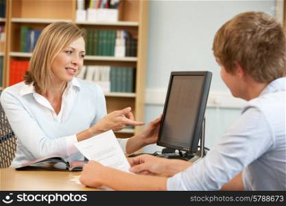 College tutor with student