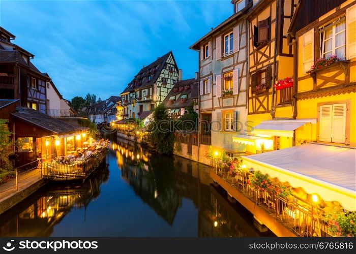 Colmar, Petit Venice, at dusk water canal and traditional colorful houses. Alsace, France.