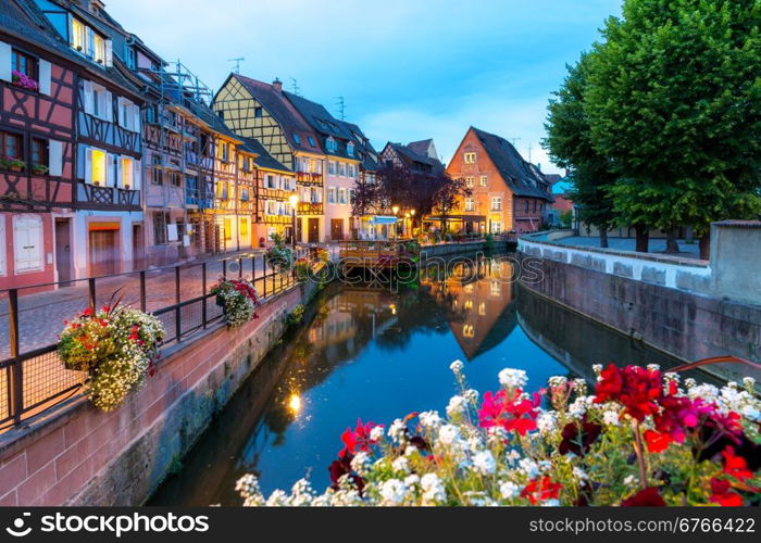 Colmar, Petit Venice, at dusk water canal and traditional colorful houses. Alsace, France.