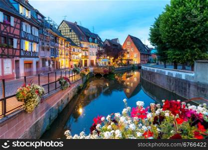 Colmar, Petit Venice, at dusk water canal and traditional colorful houses. Alsace, France.