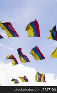 Colobian flags under blue sky in Bogota, Colombia