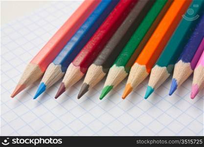 colod pencils at school notebook