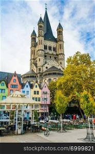 COLOGNE - NOVEMBER 07, 2018   Colorful houses in front of St. Martin’s church on november 07, 2018 in Cologne