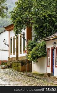 Colonial houses with colorful facades and cobblestone slopes in the historic city of Tiradentes, one of the most famous in the state of Minas Gerais. Colonial houses with colorful facades and cobblestone slopes in the historic city of Tiradentes