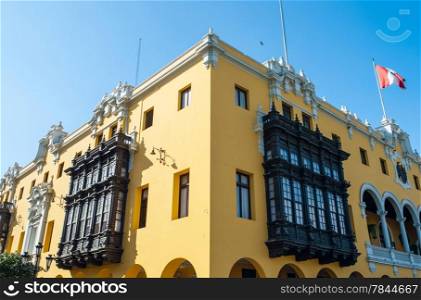 Colonial yellow building at main square called Plaza de Armas, Lima, Peru