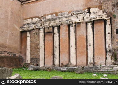 Colonnade of an ancient temple, as part of a building in Rome, Italy