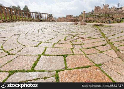 colonnade on the roman oval forum in antique town Jerash in Jordan