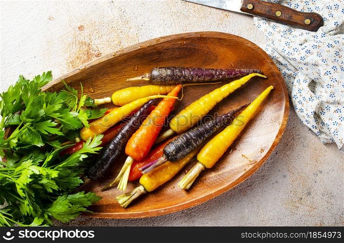 color carrot on wooden plate, color carrot