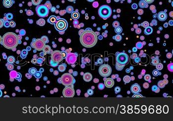 Color circles slowly fly against a dark background