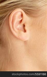 color closeup picture of blond girl ear