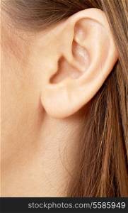 color closeup picture of brunette girl ear
