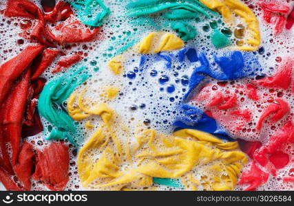 Color clothes soak, before washing.. Color clothes soak in water with washing powder, before washing.