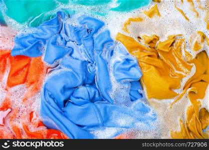 Color clothes soak before washing. Top view