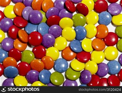 Color dragee background. Bright vivid colors. Dragee texture