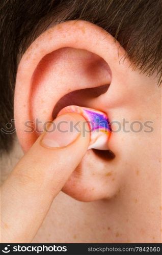 color earplug into the ear close up