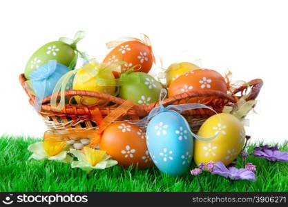 color easter eggs in basket isolated on white