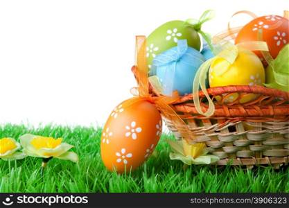 color easter eggs in basket isolated on white