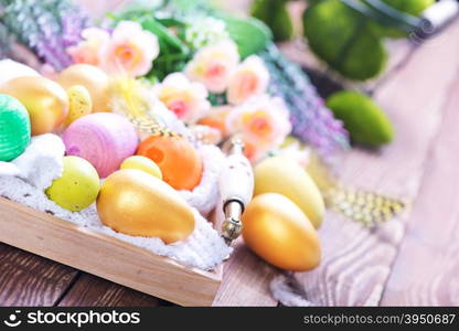 color easter eggs on a table, easter background