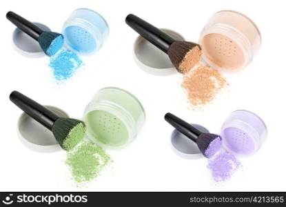 Color face powders set with make-up brush on white