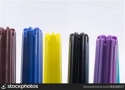 Color felt-tip pens of various color on white background
