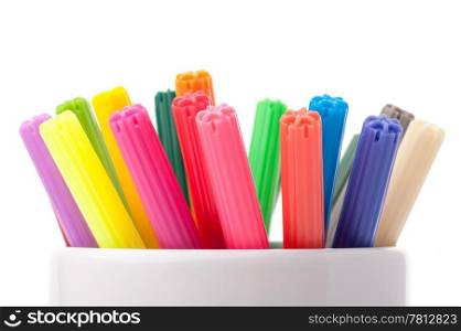 Color felt-tipped pens. Group of color felt-tipped pens in a white cup, white background, isolated