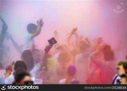 color festival in city crowd celebrating