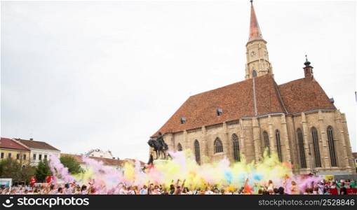 color festival in city crowd celebrating