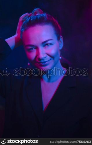 Color light on a female portrait. Neon light