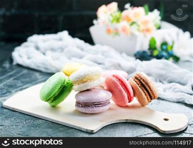 color macaroons on board and on a table