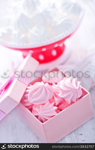 color mini meringues on the wooden table