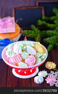 color mini meringues on the wooden table