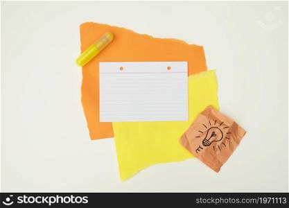 color paper glue with hand drawn light bulb note paper isolated white background. High resolution photo. color paper glue with hand drawn light bulb note paper isolated white background. High quality photo