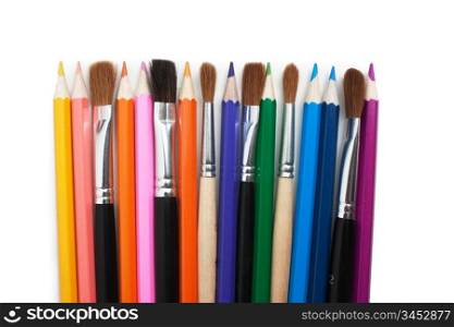 color pencils and brushes isolated on a white background